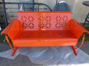 Metal love seat powder coated and orange-red color
