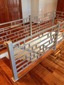 Stair rails with silver powder coating at top of stairs