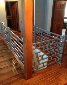 Powder coated silver railings at top of stairs